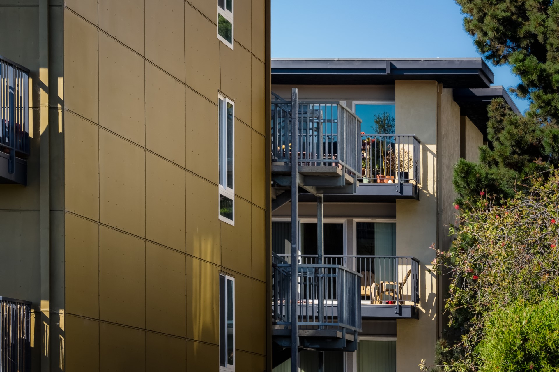 View of an apartment complex with white trimmed windows